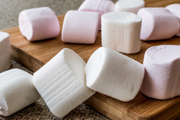 Stack of Marshmallows on wooden surface.