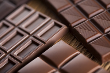 Chocolate bar, candy sweet, dessert food on wooden background