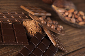 Chocolate bar, candy sweet, dessert food on wooden background