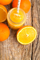 orange juice with a straw.