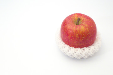 Apple wrapped with cushioning net