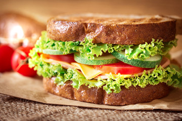 Grilled sandwiches bread with bacon , ham and cheese with vegetable , healthy breakfast