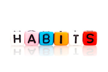 colorful word cube of habits on white background
