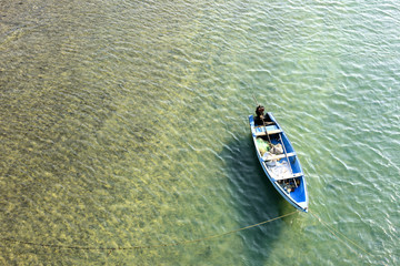 Fototapeta premium Lonely boat in a sea from Top view at Rameswaram, Tamilnadu India. 