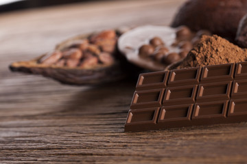 Chocolate bar, candy sweet, dessert food on wooden background
