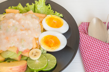Fruit salad and boiled eggs
