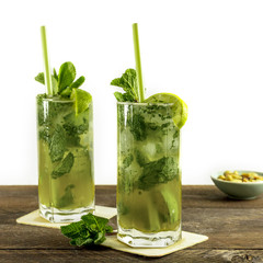 Mojito cocktail with mint leaves and lime