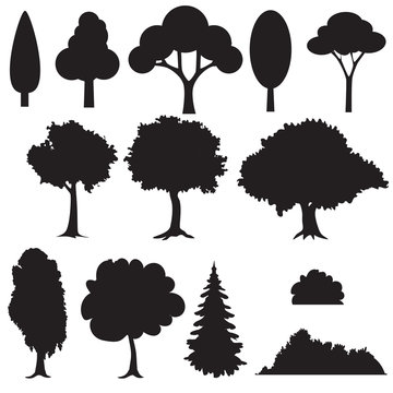 Set of various stylized trees in silhouette.
