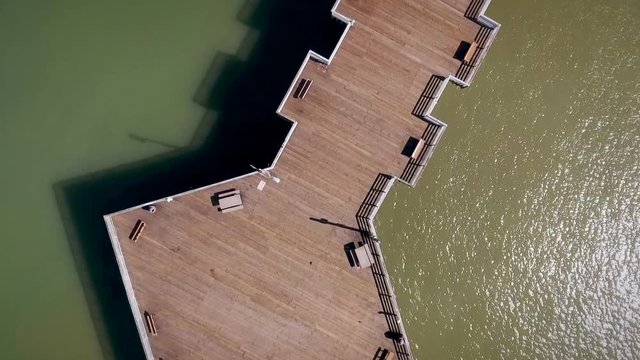 Aerial View of Pismo Beach Pier and Ocean with Surfers