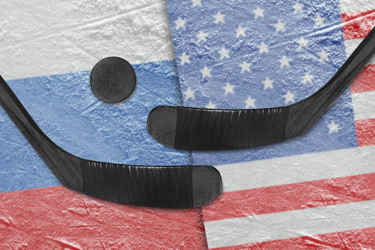 e American and Russian flags, two hockey sticks hockey