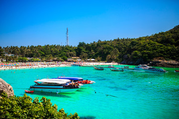 Landscape of many boats floating on the deep blue sea in summer.