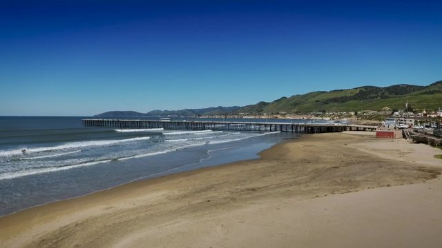 Aerial View of Pismo Beach Pier and Ocean with Palm Tree
