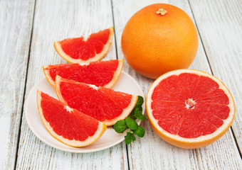 Fototapeta na wymiar Sliced ripe grapefruits