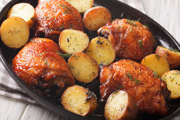 American Food: maple chicken thighs and baby potatoes close-up. horizontal