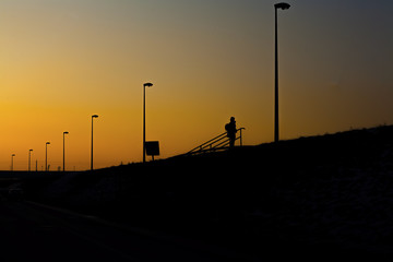 A man standing on the river bank 