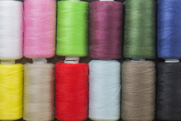 Spools of thread colorful background