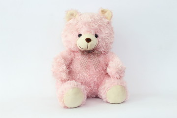 Pink teddy bear on a white background.