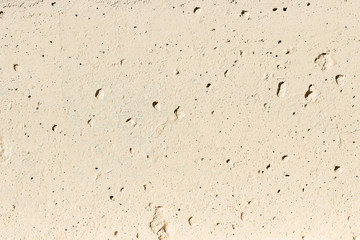 Uneven concrete surface. The protuberances on the wall