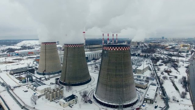 Coal power station. Cloudy weather, dusk. Aerial view 4K