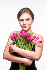 Portrait of beauty girl hugging tulips