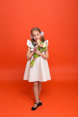 Beautiful girl with a bouquet of tulips