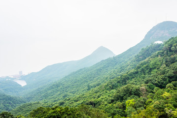 Fototapeta premium view of foggy mountain landscape at sunrise in China.