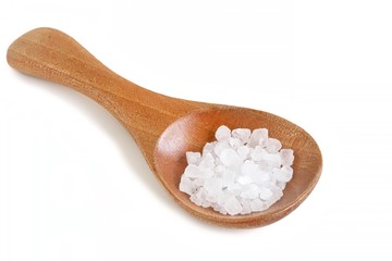 Fototapeta na wymiar Rock Salt on Wooden Spoon on White Background