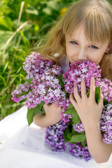 Girl in lilac garden