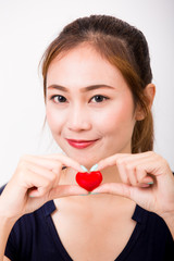 Red heart symbol in female hand
