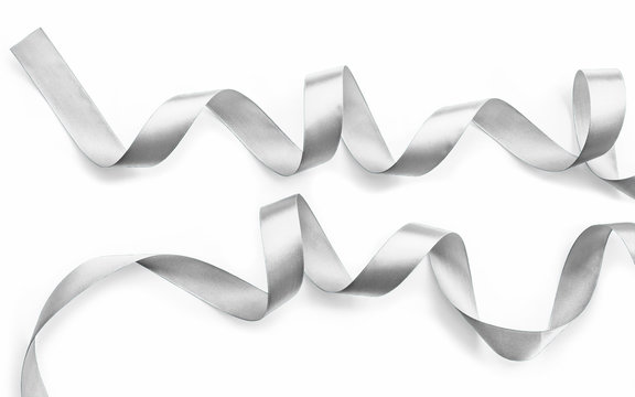 Silver ribbon bow in bright white grey color isolated on white background with clipping path for holiday and party greeting card design decoration element