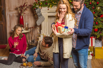 Couple sharing christmas presents