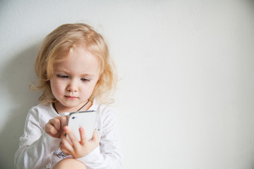 beautiful little girl with a smartphone