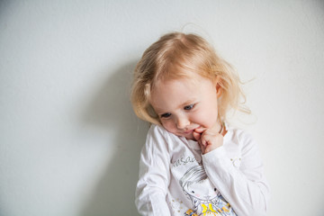 Portrait of a emotional beautiful little girl. Isolated on white background.