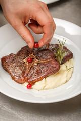 Chef finishing her plate