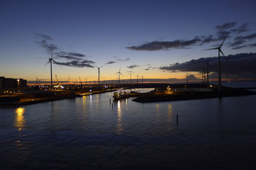 Fototapeta na wymiar Energy windmills in sunset