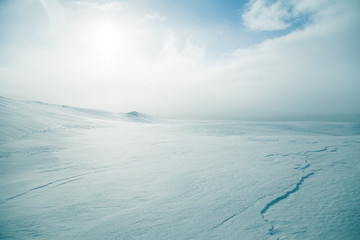 A beautiful, minimalist landscape of snowy Norwegian hills. Clean, light, high key, decorative look.