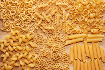 Close up of several types of dry pasta on  table