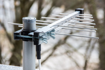 Small television aerial antenna outside on windows sill – Digital DVB-T TV signal