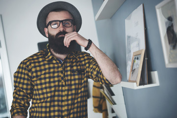 Bearded young man at home office