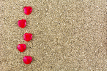 Fototapeta na wymiar Red Heart-shaped Sweets Put on the wooden floor.