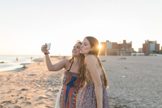 Best Friends Taking a Picture with a Mobile Phone. Coney Island New York City US
