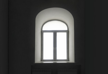 Fototapeta na wymiar white semicircular modernist windows on a black wall