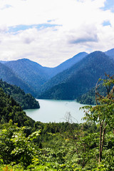 Fototapeta na wymiar Green mountain valley with a lake in Abkhazia.