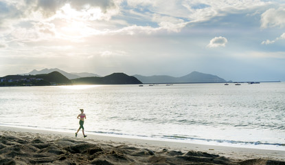 Fototapeta na wymiar Sport woman running on the beach