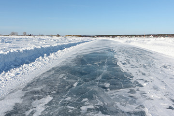 Ice road on a frozen reservoir in the winter,  Ob River, Siberia, Russia