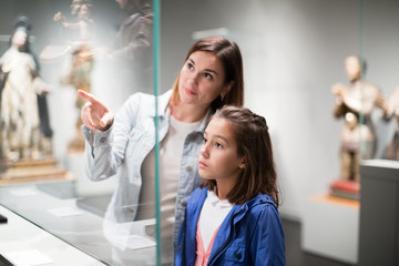 Mother and daughter in museum