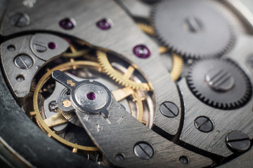 Clockwork old mechanical pocket watch. Macro shot.