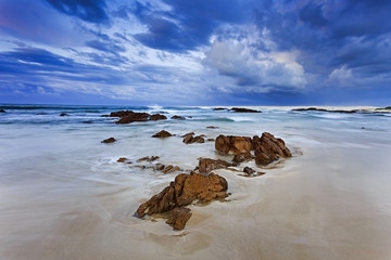 Fototapeta na wymiar Sea Birubi Small Rocks sand