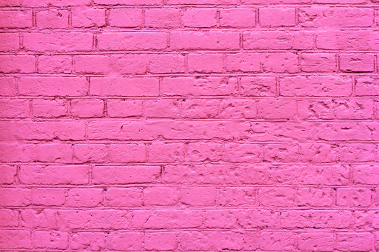 Grunge pink brick wall as background, texture