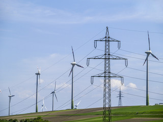 Fototapeta na wymiar Electricity, power pole, high-voltage line, wind turbines, Austr